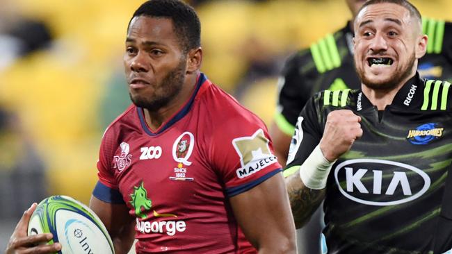 Filipo Daugunu of the Reds (left) runs with the ball ahead of TJ Rerenara of the Hurricanes during the Round 14 Super Rugby match between the Hurricanes and the Queensland Reds at Westpac Stadium in Wellington, New Zealand, Friday, May 18, 2018. (AAP Image/SNPA, Ross Setford) NO ARCHIVING, EDITORIAL USE ONLY