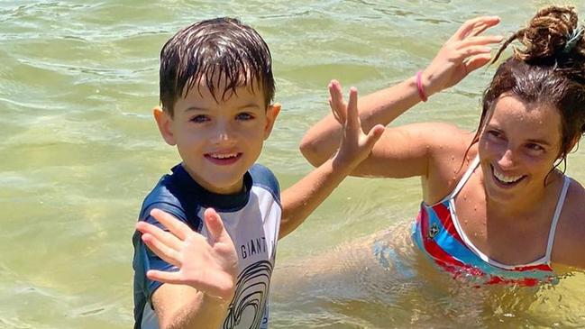 Wallaroos player Lori Cramer with a What Ability participant at the beach. Picture: Supplied