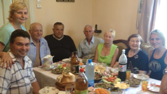 Enjoying a meal with her Ukrainian family on a visit in 2013.