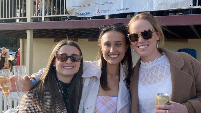 A trio revels in the fun of the Dubbo Kangaroos Rugby Club Ladies Day. Photo: Tijana Birdjan