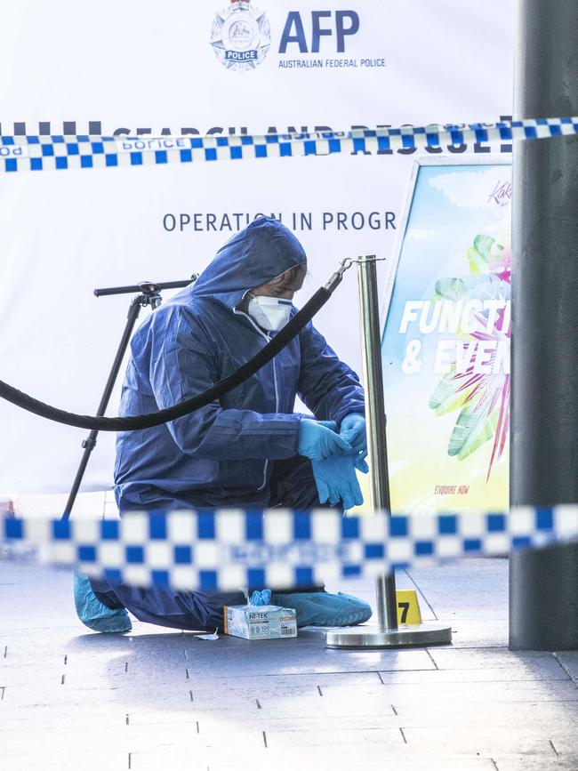 An AFP Forensic Officer outside Kokomo’s after the alleged murder of Pitasoni Ulavalu. Picture: Gary Ramage