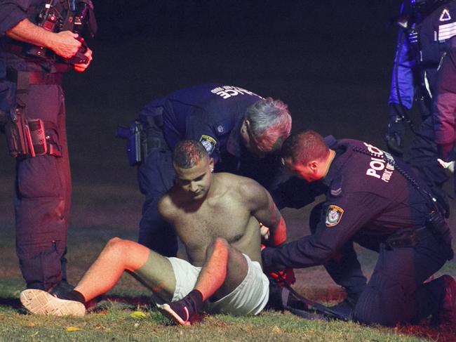 Man arrested by Police in Centennial park after coming out of the "Listen out" music festival.