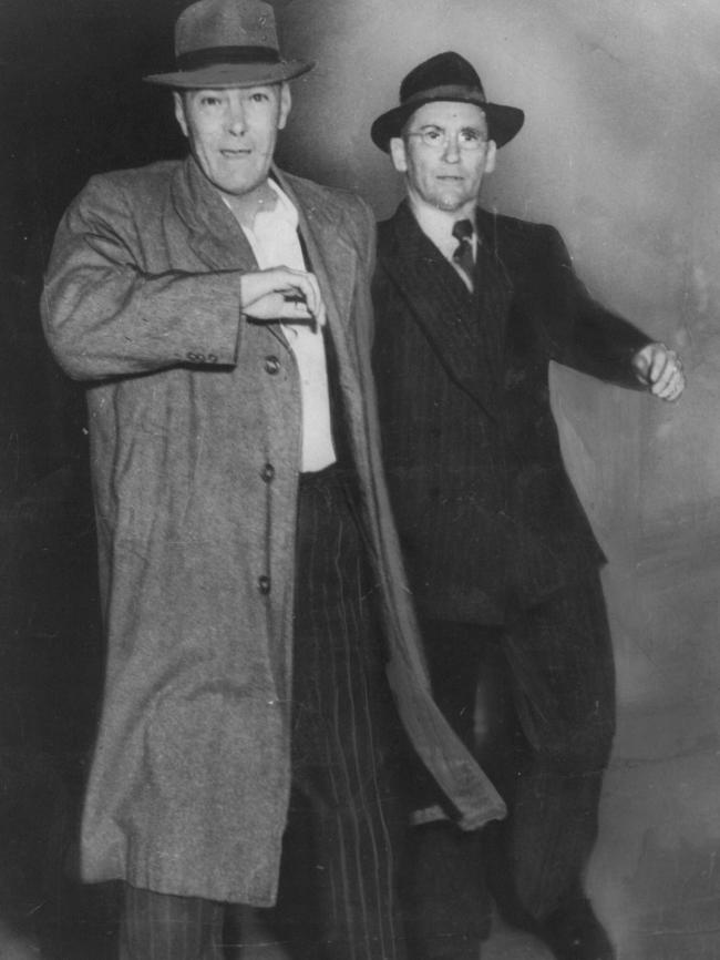 John Hayes restrained by detective Ray Kelly in 1951.