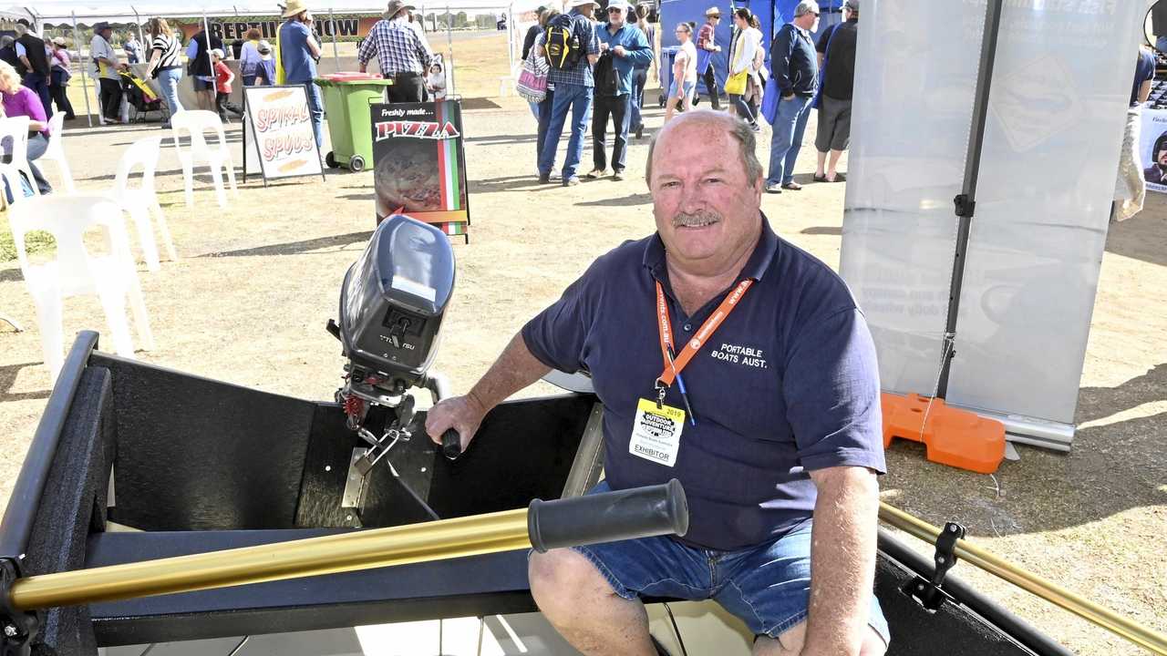 Colin Robinson of Portable Boats Australia demonstrates the fold up dingy at the Queensland Outdoor Adventure and Motoring Expo. Picture: Bev Lacey