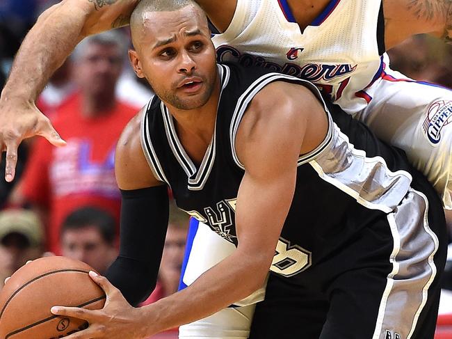 LOS ANGELES, CA - APRIL 22: Patty Mills #8 of the San Antonio Spurs is fouled by Dahntay Jones #31 of the Los Angeles Clippers during Game Two of the Western Conference quarterfinals of the 2015 NBA Playoffs at Staples Center on April 22, 2015 in Los Angeles, California. NOTE TO USER: User expressly acknowledges and agrees that, by downloading and or using this Photograph, user is consenting to the terms and condition of the Getty Images License Agreement. Harry How/Getty Images/AFP == FOR NEWSPAPERS, INTERNET, TELCOS & TELEVISION USE ONLY ==