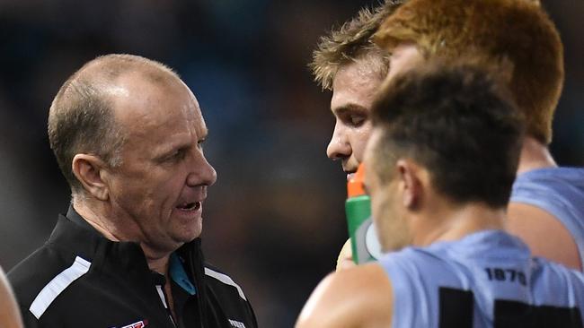 Power coach Ken Hinkley (left) speaks to Ollie Wines during the Round 7 AFL match against Collingwood. Picture: AAP Image/Julian Smith