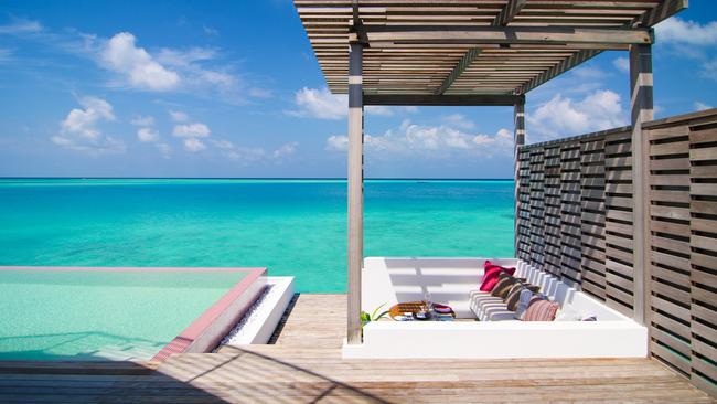 Pool deck of a private villa at LUX North Male Atoll in The Maldives.