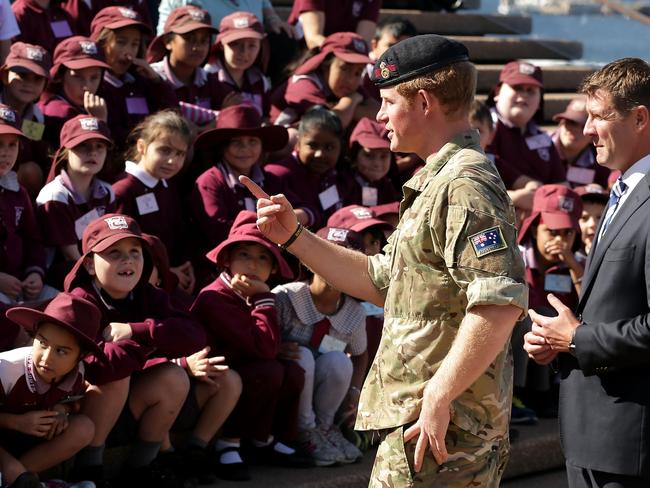 Prince Harry has made the day of a group of students from St Mary’s Public School greeting them on the steps at the Sydney Opera House. Picture: Getty Images