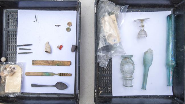 Hundreds of artefacts, some dating back to early 1800s, have been uncovered at Hunter Street’s metro site. Glass and miscellaneous items, including a toothbrush, a spoon, a thimble and buttons, retrieved. Picture: supplied