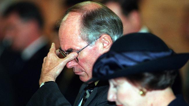 Former prime minister John Howard with wife Janette during a memorial service in 1996.