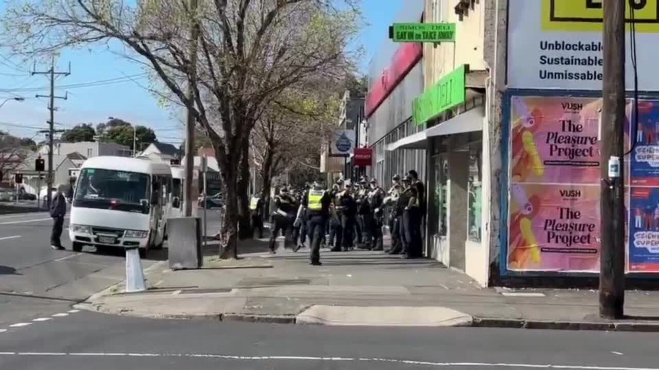 There's a heavy police presence as protesters rally against the Land Forces expo