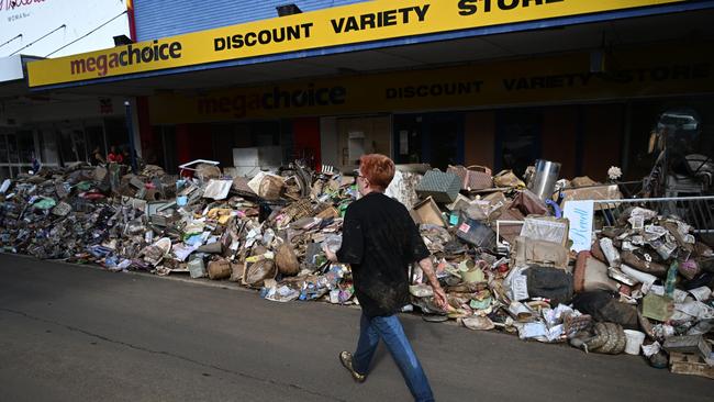 Piles of flood-damaged goods line a main street in Lismore. (Photo by Dan Peled/Getty Images)