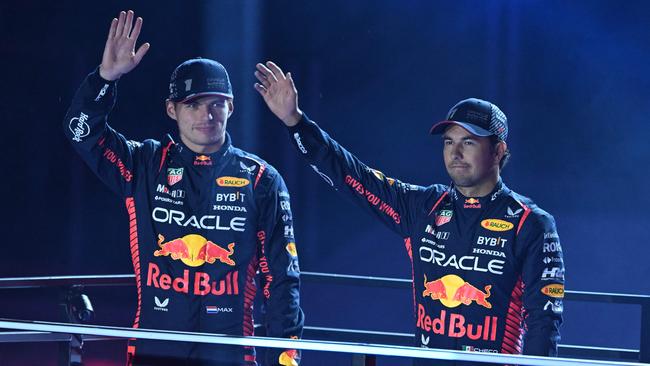 Red Bull Racing's Dutch driver Max Verstappen and teammate Sergio Perez participate in the opening ceremony for the Las Vegas Grand Prix. Photo by Jim WATSON / AFP.