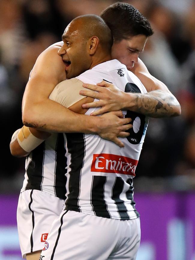 Travis Varcoe and Jack Crisp celebrate a goal.