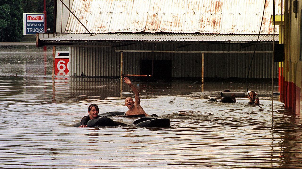 Children play in floodwaters after school was cancelled, February 10, 1999. Photo: Grainger/Laffan