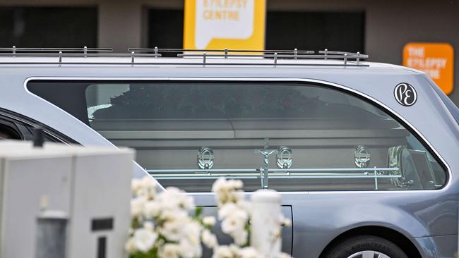 Carmelo Loprete’s coffin was carried into the silver hearse that bore the Australian and Italian flags on its front. Picture: NewsWire