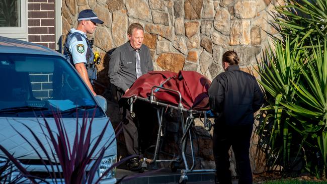 The body of the deceased man is removed from the home on Westwood Court at Harrington Park. Picture: Monique Harmer