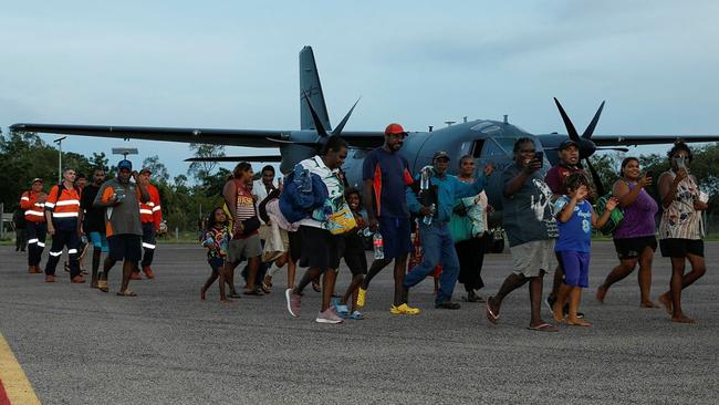 Borroloola evacuees were forced to cross Rocky Creek by boat to get to the airstrip.