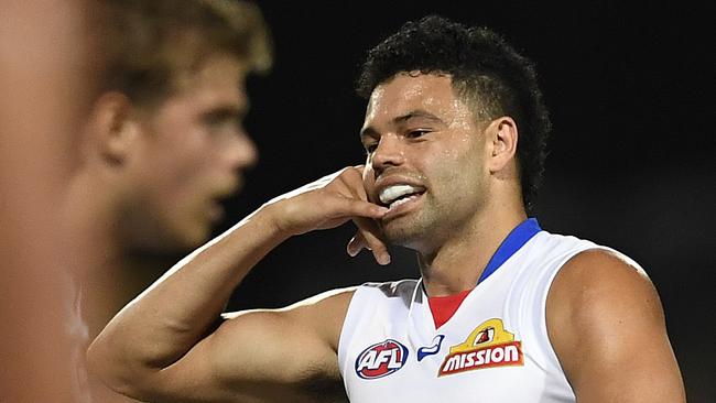 Jason Johannisen celebrates a goal against the Dockers.