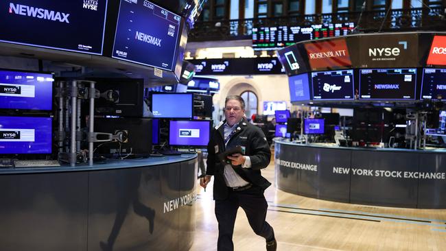 A trader runs on the floor of the New York Stock Exchangeat the opening bell in New York City on April 3. Picture: AFP