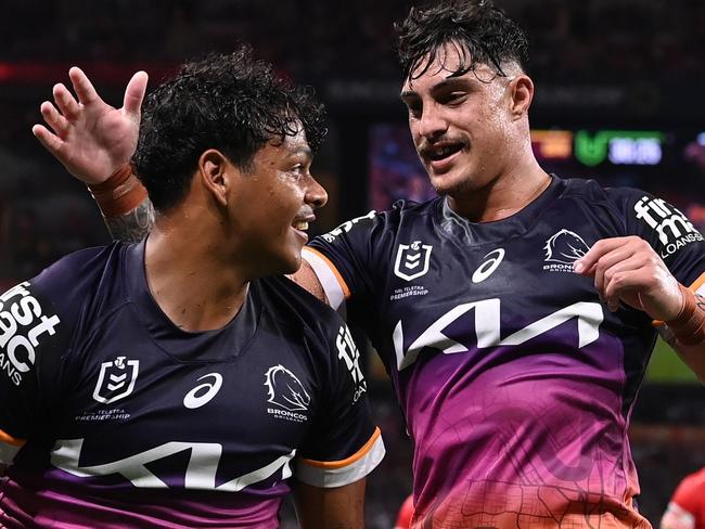 BRISBANE, AUSTRALIA - MARCH 24: Selwyn Cobbo (L) of the Broncos celebrates scoring a try with Kotoni Staggs during the round four NRL match between the Dolphins and Brisbane Broncos at Suncorp Stadium on March 24, 2023 in Brisbane, Australia. (Photo by Bradley Kanaris/Getty Images)