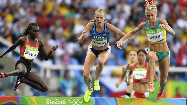 (L-R) Kenya's Hyvin Kiyeng Jepkemoi, USA's Courtney Frerichs, and Australia's Genevieve LaCaze compete in the Women's 3000m Steeplechase Round 1 during the athletics event at the Rio 2016 Olympic Games at the Olympic Stadium in Rio de Janeiro on August 13, 2016. / AFP PHOTO / Fabrice COFFRINI