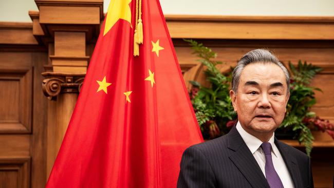 Chinese Foreign Minister Wang Yi arrives for a meeting with New Zealand Prime Minister Christopher Luxon.