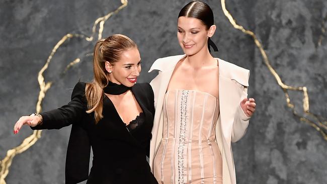 Designer Michelle Aznavorian and model Bella Hadid walk the runway during the Misha Collection show at Mercedes-Benz Fashion Week. Picture: Getty Images