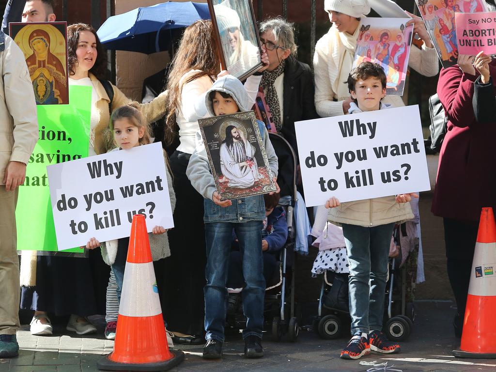 Pro life and pro choice protestors gathered at the front of NSW State Parliament in Sydney ahead of the debate of a possible abortion bill. Picture: Richard Dobson