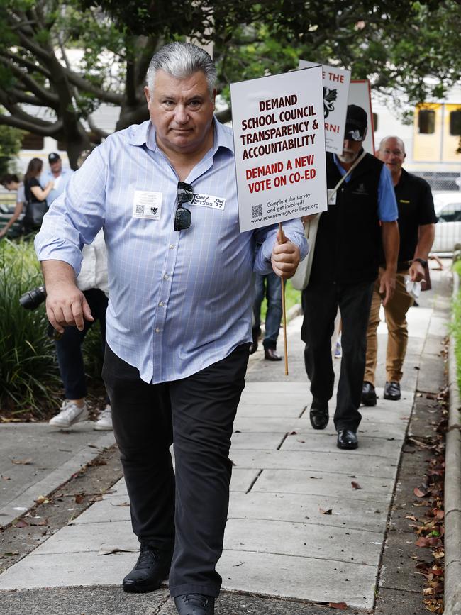 Anti-co-ed Newington College parents walking towards the school in a silent protest against the proposed switch to Newington College becoming a co-ed school. Picture: Richard Dobson