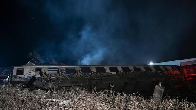 A fire services spokesman confirmed that three carriages skipped the tracks just before midnight after the trains collided. Picture: AFP.