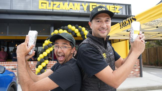 Franchisee Dante Reynaud (with glasses) and his business partner Saul Marin at the launch of Toowoomba's first Guzman Y Gomez (GYG) drive-through restaurant at Wilsonton, February 15, 2024.