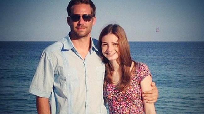 Meadow Walker, pictured with her father the late Paul Walker, has reached a settlement with the estate of the man driving the Porsche that crashed and claimed the Fast and the Furious star’s life.