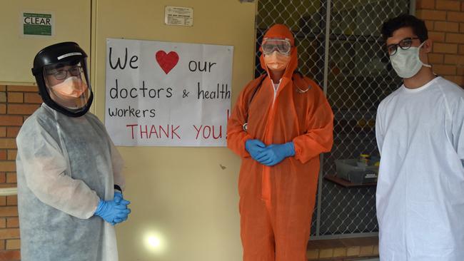 Dr Olivia and Derek Bell with David Cheney at the Bellingen Community Covid-19 clinic where patients drive in for testing.