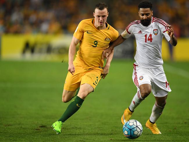 Australia's Brad Smith is tackled by the United Arab Emirates' Abdelaziz Sanqour during their World Cup Qualifier match between Australia and United Arab Emirates at the Sydney Football Stadium in Sydney, Tuesday, March 28, 2017.  (AAP Image/Dean Lewins) NO ARCHIVING, EDITORIAL USE ONLY
