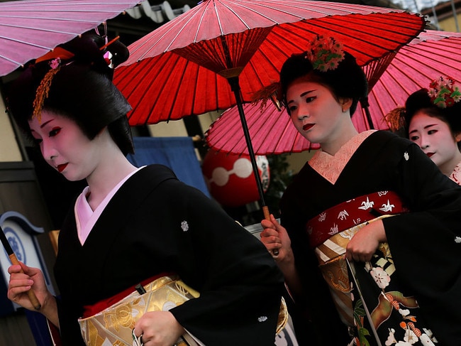 KYOTO, JAPAN - JANUARY 07: Japanese traditional female dancers, maikos, and performers, geikos leave after attend the new year's ceremony at the Gion Kobu Kaburenjo Theater on January 7, 2016 in Kyoto, Japan. At the new year's ceremony, maikos, geikos, and the masters of their schools all gather in one place and celebrate the start of new year's operation and announce the best performing dancers, performers, and best tea houses of the previous year. (Photo by Buddhika Weerasinghe/Getty Images)