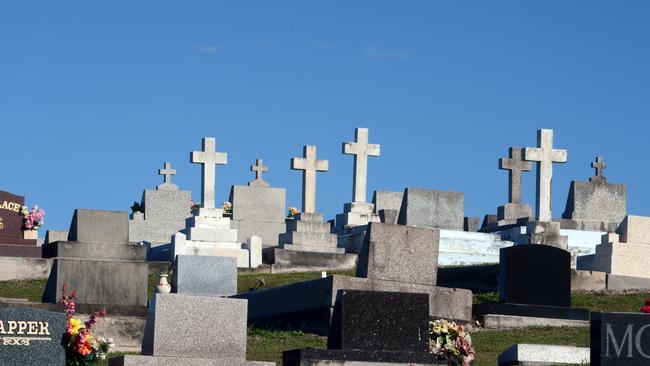 Several headstones and the front entrance gate were removed from the cemetery. Picture: Cathy Adams.