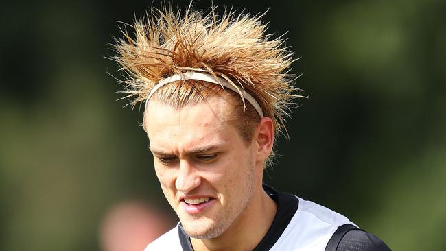 Darcy Moore of the Magpies sports a new hair style during a Collingwood Magpies AFL training session.