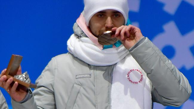 Aleksandr Krushelnitckii says he will return the bronze medal he won with wife Anastasia Bryzgalova in the curling mixed doubles. Picture: AFP