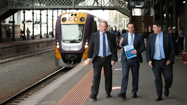 Opposition leader Matthew Guy, centre, spruiking his plan at Geelong station earlier this month. Picture: Alison Wynd