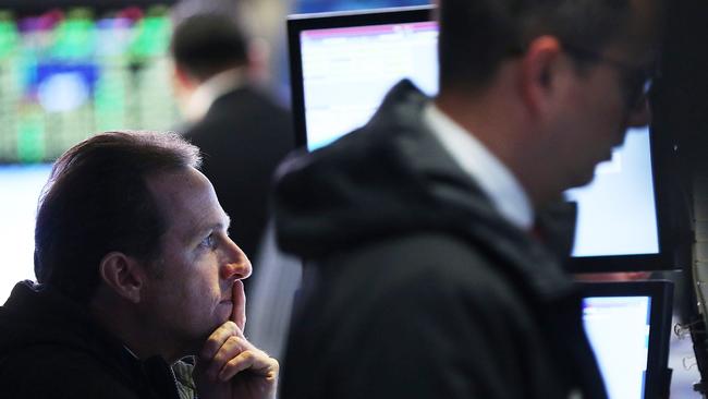 NEW YORK, NY - DECEMBER 03: Traders work on the floor of the New York Stock Exchange (NYSE) in afternoon trading on December 3, 2015 in New York City. The Dow Jones industrial average is down over 120 points in afternoon trading on news that the European Central Bank's new stimulus plan is not as aggressive as some investors had hoped. Spencer Platt/Getty Images/AFP == FOR NEWSPAPERS, INTERNET, TELCOS & TELEVISION USE ONLY ==