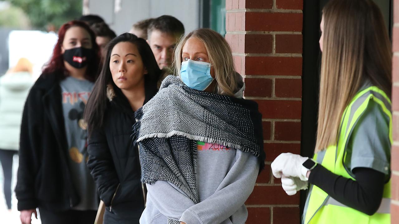 Shoppers line up outside Woolworths in Moonee Ponds in northwest Melbourne. Picture: NCA NewsWire / Ian Currie