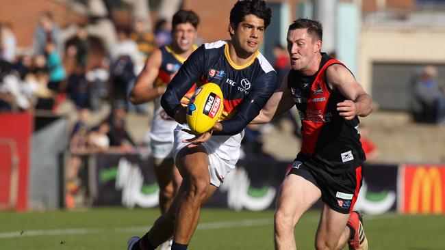 SANFL: West Adelaide v Adelaide at Richmond Oval. Adelaide's Shane McAdam breaks away from West's Jack Evans. 8 June 2019. (AAP Image/Dean Martin)