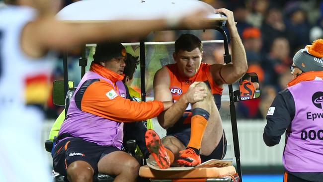 Heath Shaw is assisted from the field after injuring his knee in Canberra in Round 21. Picture: Getty Images