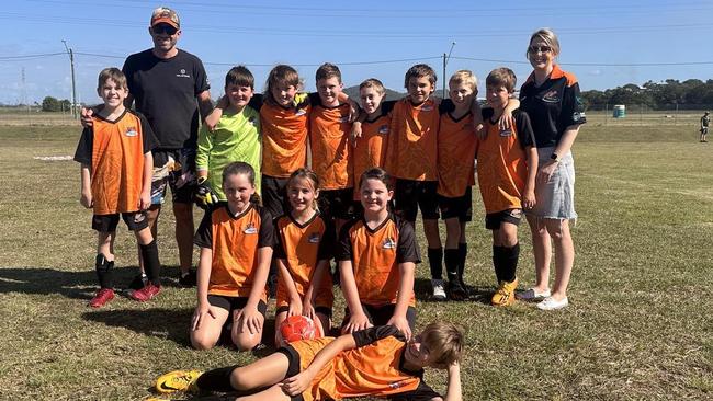 Country United U11 Orange team members (back from left) Riley Vaughan, Coach Glenn Borg, Josh Dawes, Jacob Robinson, Ashton Martin, Mason Loveday, Jaxon McGrath, Quinn Moore, Lachlan Dwyer, Assistant Manager Claire Loveday, Indie Fairley, Kyah-Perry Whitcher, Scarlett Harlow and Connor Borg. Absent from picture: Ashton Camilleri, Nate Beesley, Hudson Crane, Manager Samson Robinson