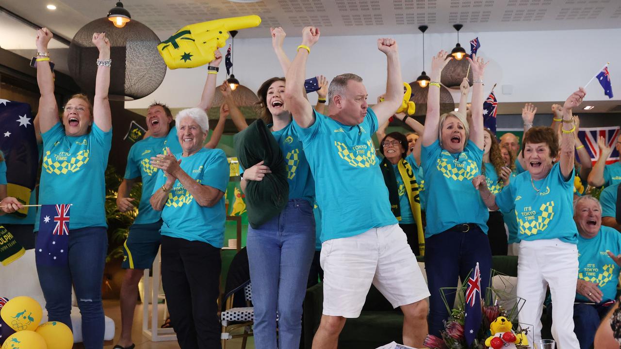 Steve and Robyn Titmus with family and friends celebrate Ariarne’s Olympic 200m freestyle win at Noosa. Picture: Lachie Millard