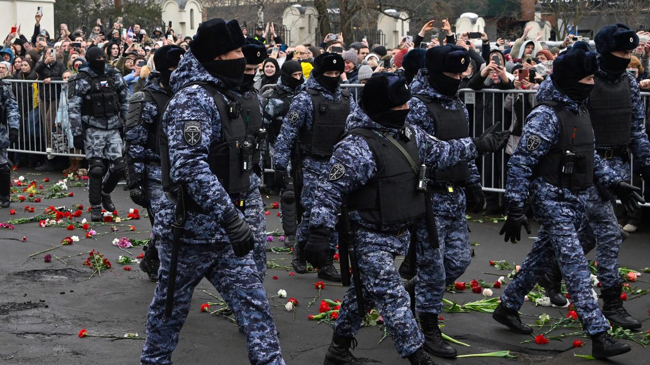 Police walk outside the Mother of God Quench My Sorrows church after a funeral service for late Russian opposition leader Alexei Navalny, in Moscow's district of Maryino on March 1, 2024. (Photo by Alexander NEMENOV / AFP)