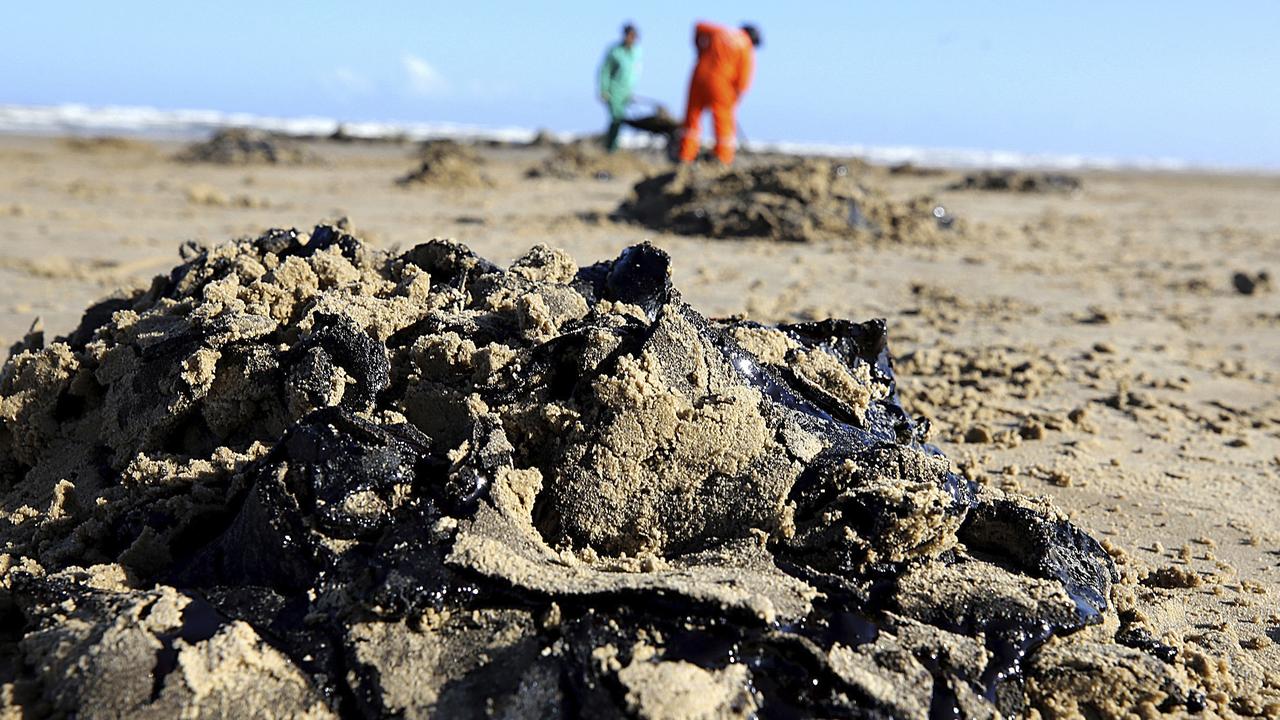 Crime ‘likely’ in Brazil oil slicks that have destroyed postcard beaches. Picture: Andre Moreira/Aracaju Municipal Press Office via AP.