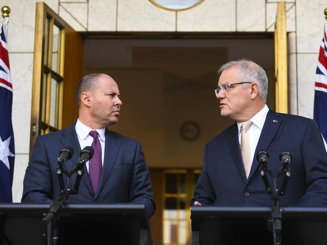 Australian Prime Minister Scott Morrison (right) and Australian Treasurer Josh Frydenberg speak to the media during a press conference at Parliament House in Canberra, Thursday, March 12, 2020. (AAP Image/Lukas Coch) NO ARCHIVING