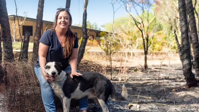 Leanne Hopkins with her dog Noddy, at her property which was surrounded by the bushfire in Noonamah on Monday night. Noddy was evacuated by a neighbour. Picture: Che Chorley